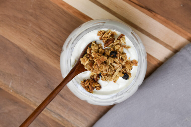 yogurt and granola on wooden board